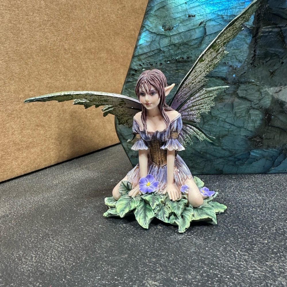 Enchanted Fairy Figurine with Green and Purple Accents